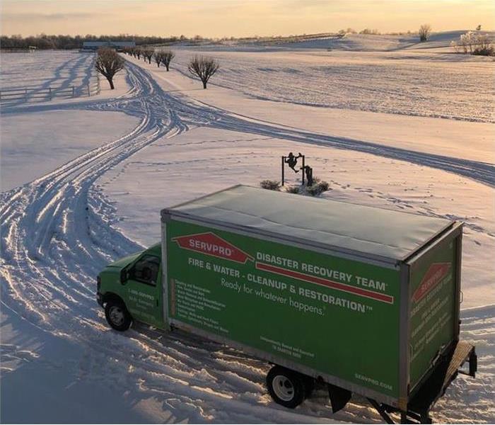 servpro truck driving through the snow