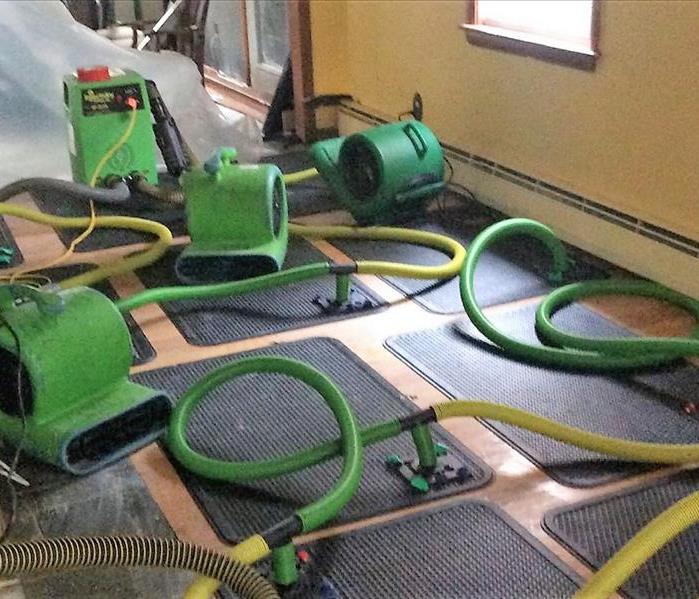 Servpro equipment drying hardwood floors