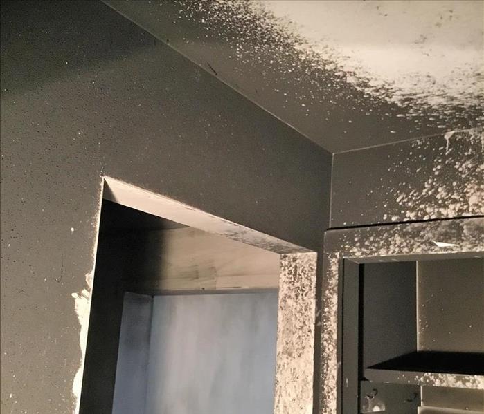 Walls of a home covered with black soot